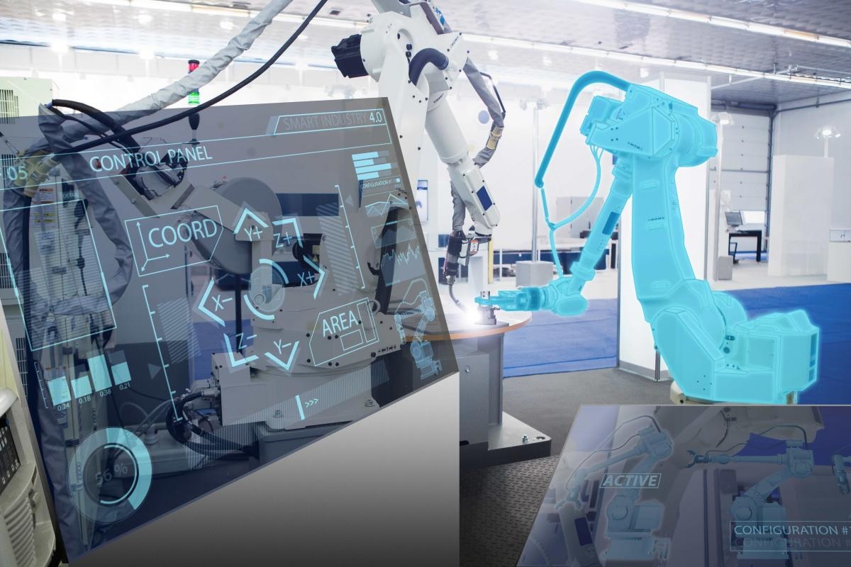 Photo of a robotic arm in front of a large touch-screen industrial computer screen